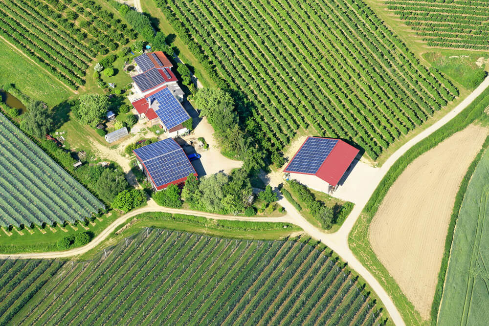 farm land aerial view of crops and hills