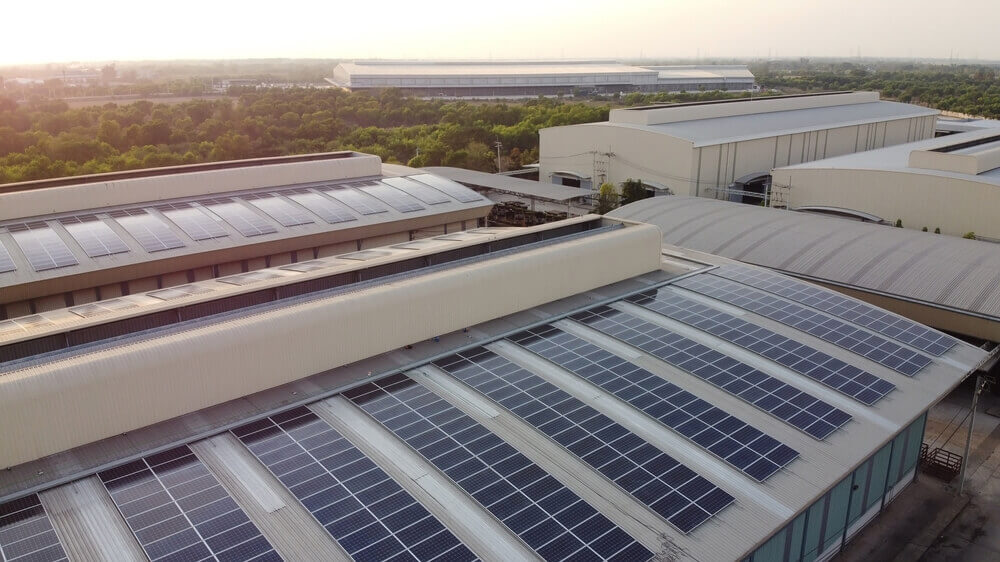 solar panels installed on a large industrial roof