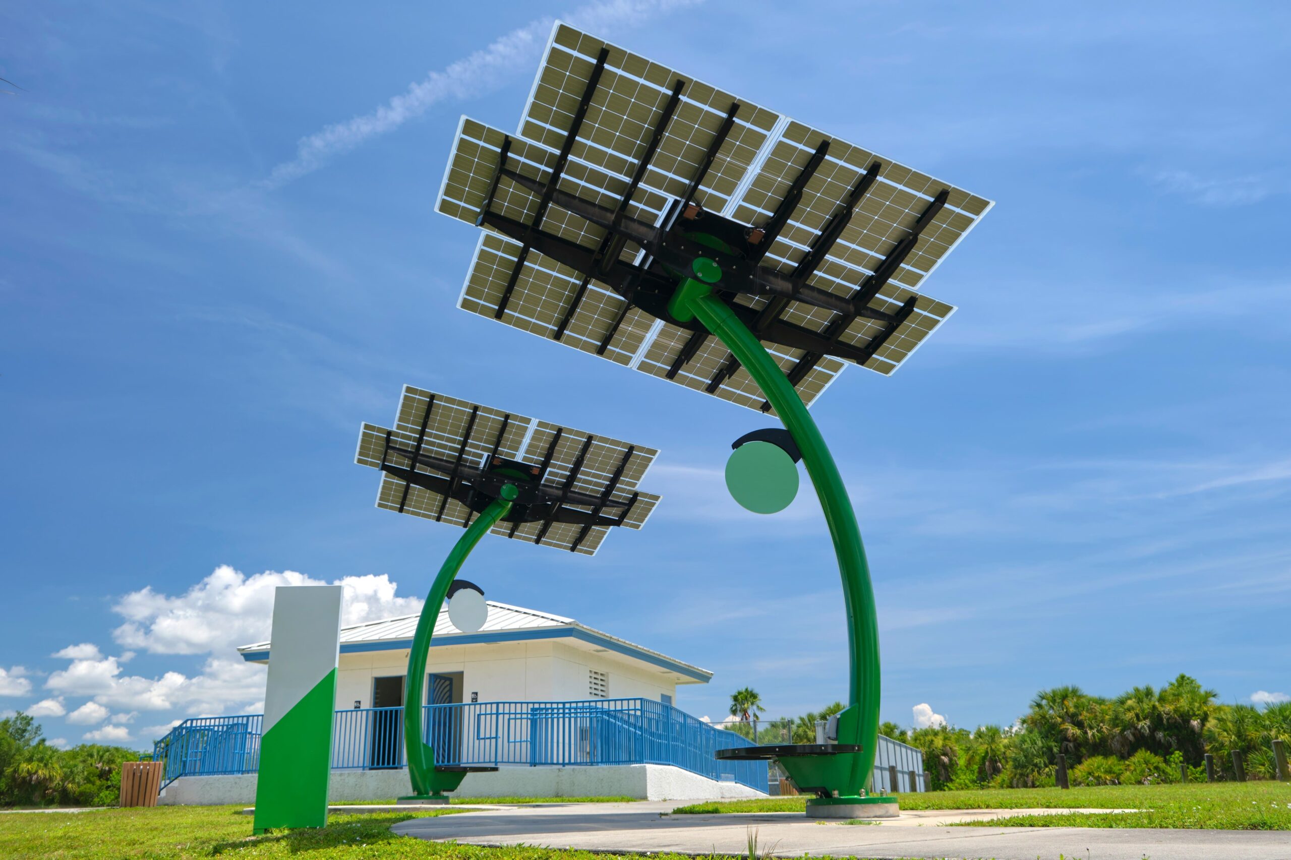 Innovative solar panel installations with a unique design in a park setting, showcasing modern solar energy solutions.